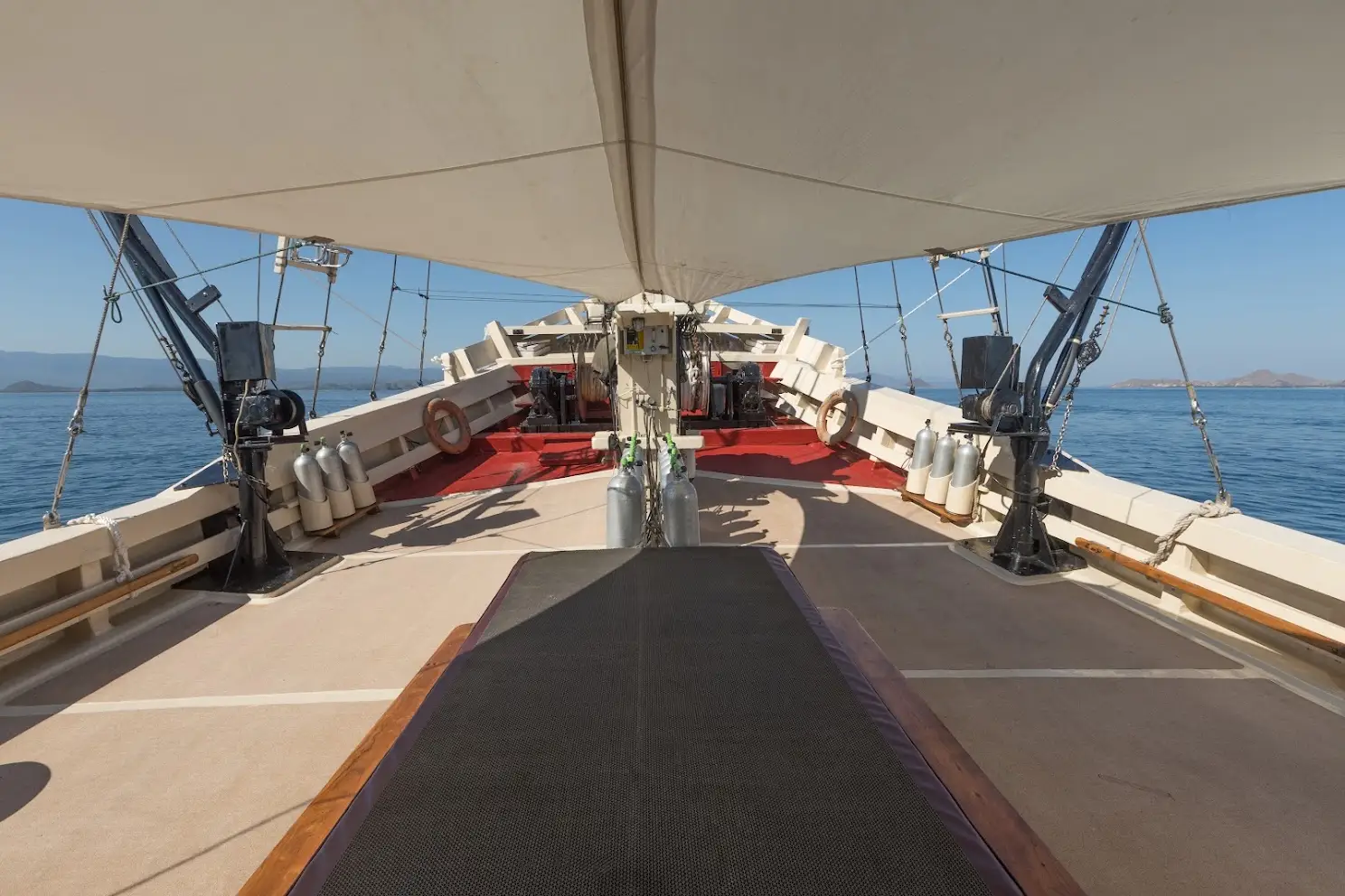 Dive deck with tank racks and tender davits on Seven Seas Liveaboard | Komodo Luxury