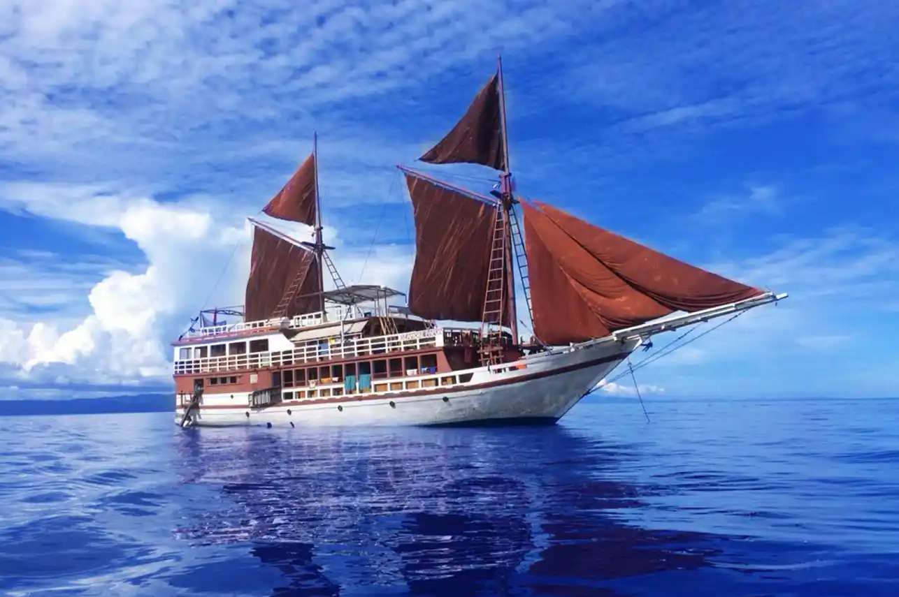 Exterior view of Seamore Papua Liveaboard, a traditional wooden phinisi schooner | Komodo Luxury