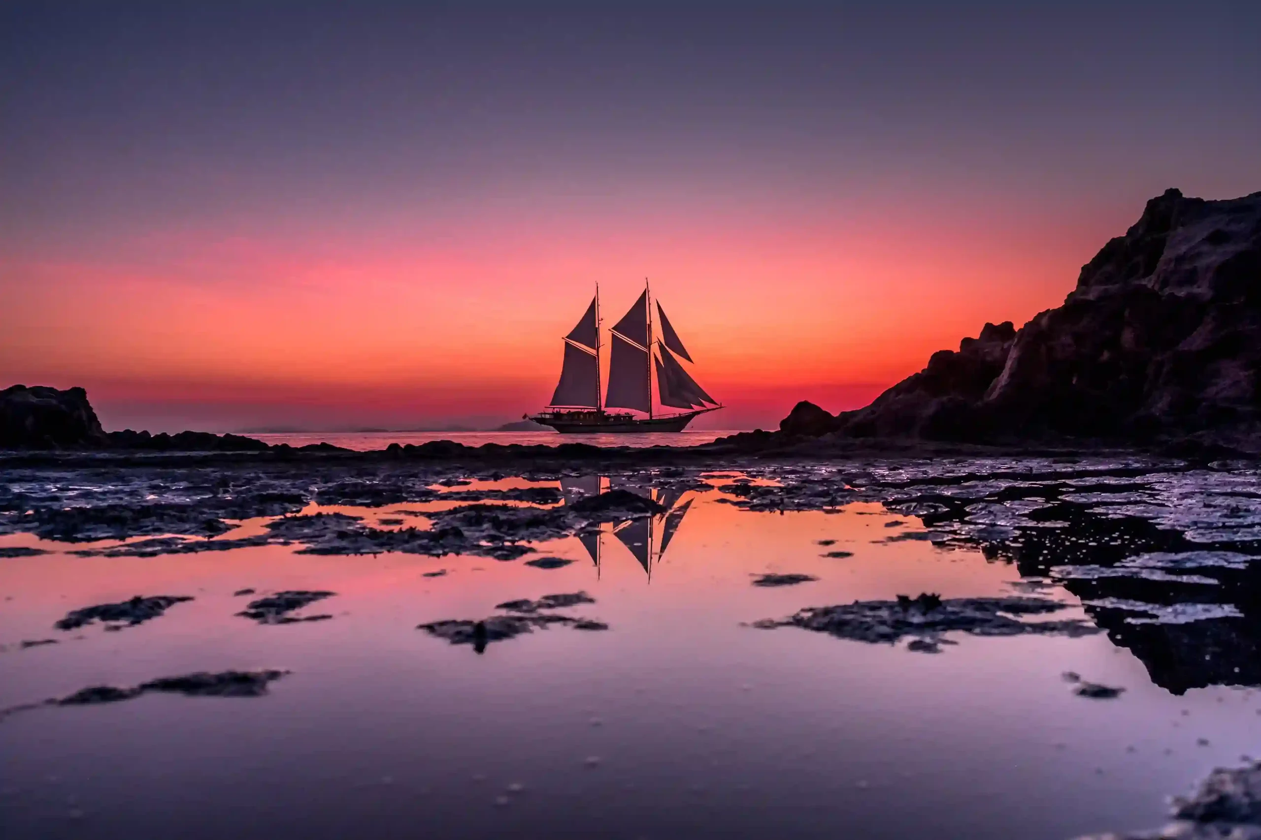 Lamima phinisi sailing sunset by Komodo Luxury